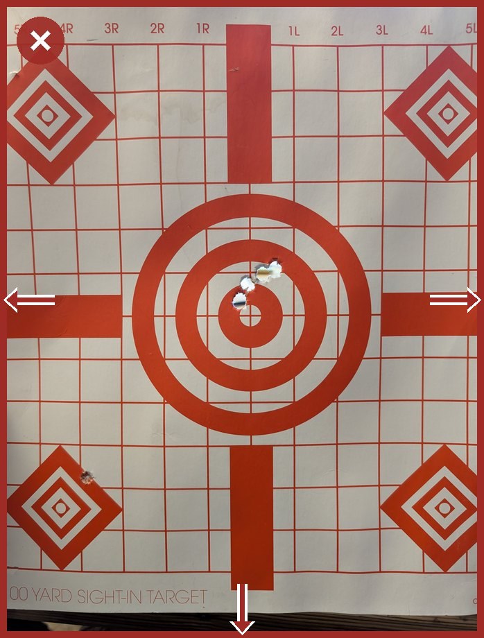 A target photographed too close, with arrows pointing to the left, right and bottom edges where the target runs off the frame.